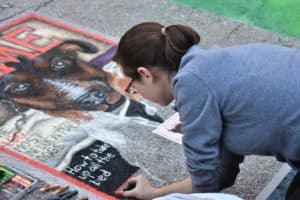 Artist doing street chalk art