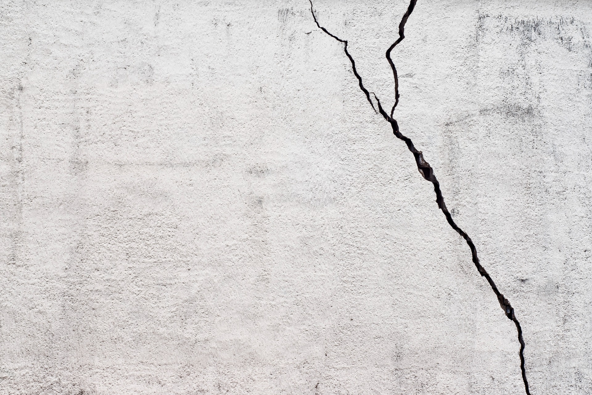 This is a photo of a large crack in a concrete surface.